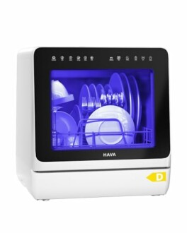 Compact countertop dishwasher with dishes inside.