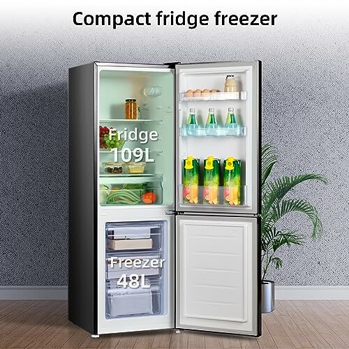 Compact fridge freezer with open doors showing contents.