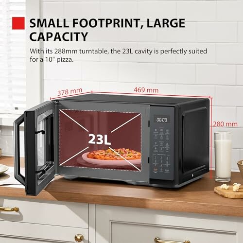 Compact microwave with dimensions and pizza inside.