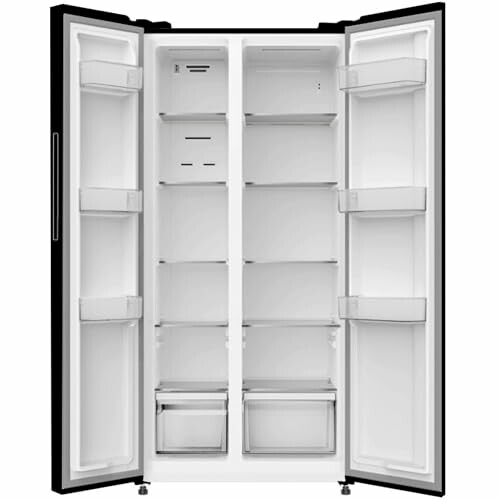 Open empty side-by-side refrigerator with shelves and drawers.