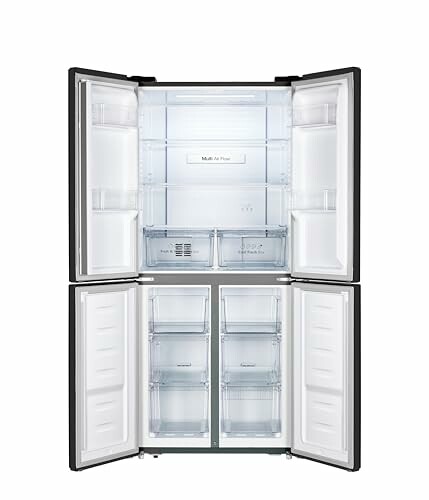 Open four-door refrigerator with empty shelves.