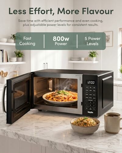Microwave with pasta dish inside on kitchen counter.