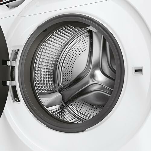 Open washing machine drum with metallic interior