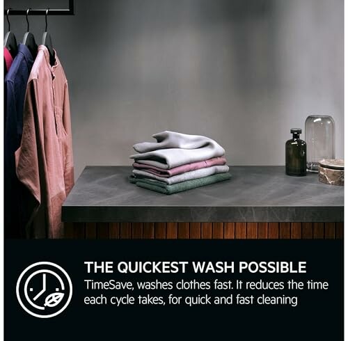 Stack of folded clothes on a countertop with quick wash promotion.